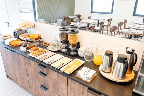 a buffet line with breakfast foods on it at Casa Dona Edite Guesthouse Douro in Vilarinho de Cotas