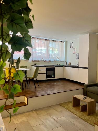 a living room with a couch and a table at Maison Naturalistica - A 5 Fermate Dal Duomo in Milan