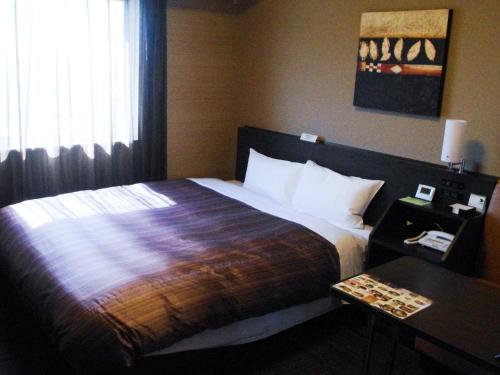 Letto o letti in una camera di Hotel Route Inn Hamamatsu Dealer Dori