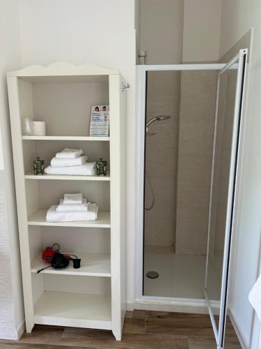 a shower in a bathroom with a glass door at Casa Rosetta Affittacamere in Iesi