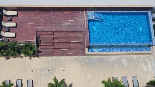 Πισίνα στο ή κοντά στο Cómodo Apartamento frente al Mar