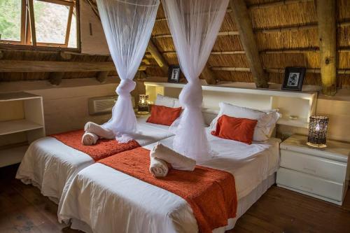 Postel nebo postele na pokoji v ubytování Majuli River Lodge - overlooking Kruger Park