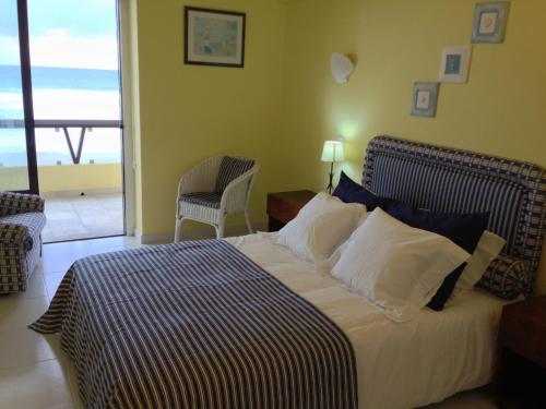 
A bed or beds in a room at Apartamento Praia Grande Sintra
