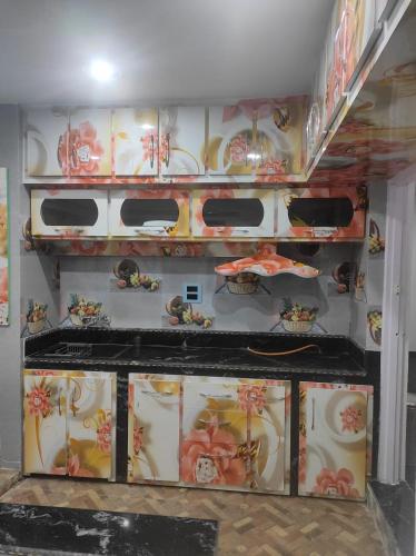 a room with a bunch of plates on a wall at New Delight Hotel in Kanzalwan