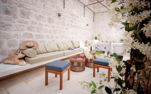 a living room with a couch and some tables at Villa Dida Hvar in Hvar