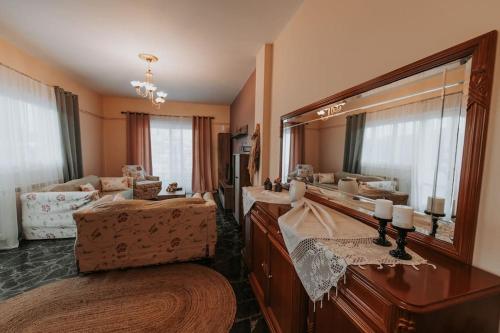 a bathroom with a large mirror and a sink at tony's house in Kámpos