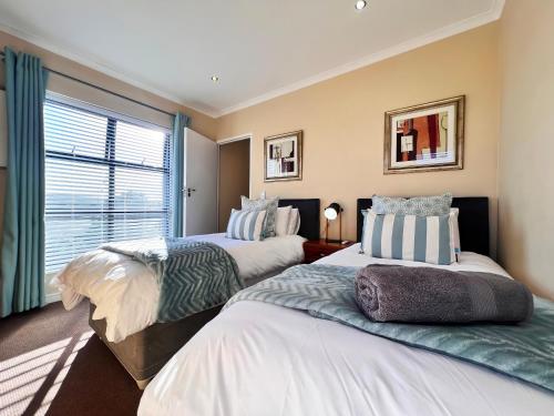 Giường trong phòng chung tại Ellefsen 117 Golf Retreat