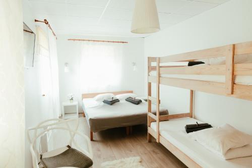 Postel nebo postele na pokoji v ubytování Konrad Family Guesthouse