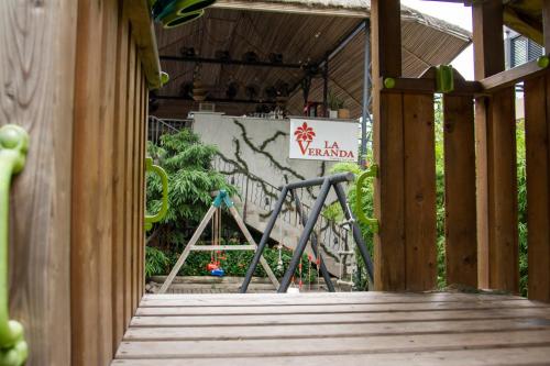 a wooden walkway with a sign on a wall at The Blowfish Hotel in Lagos