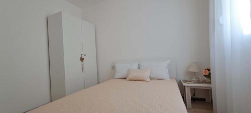 Postel nebo postele na pokoji v ubytování Apartments MISTEMI