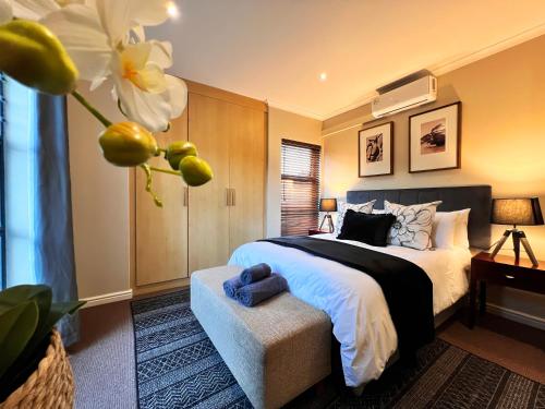 a bedroom with a large bed and a window at Ellefsen 134 Golf Paradise - NEWLY RENOVATED! in Langebaan