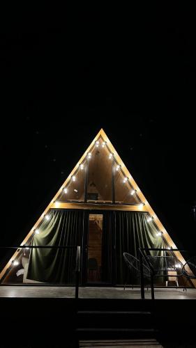 a large tent with lights on it at night at Villa Tsinandali in Tsinandali