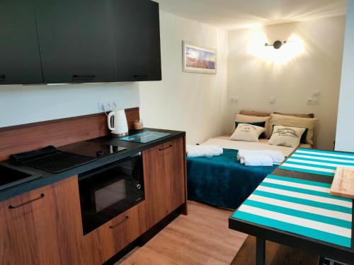 Ένα ή περισσότερα κρεβάτια σε δωμάτιο στο Chalet vacances avec jardin près d'Arcachon 2 personnes