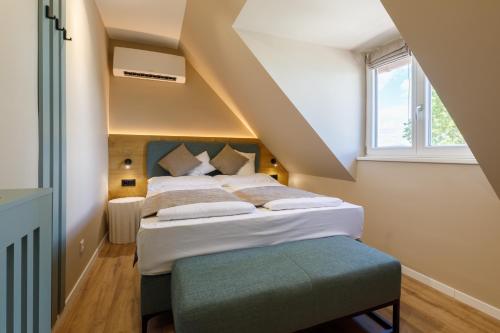 Postel nebo postele na pokoji v ubytování Lepke Apartmanház és Étterem