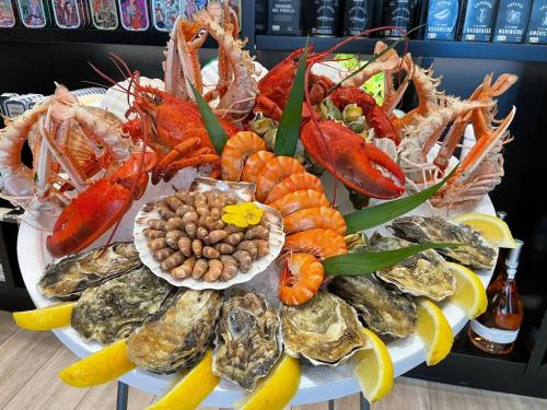 a display of seafood on a table in a store at Studio moderne en bord de mer in Cabourg