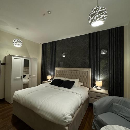 Ένα ή περισσότερα κρεβάτια σε δωμάτιο στο The Elegance Rooms