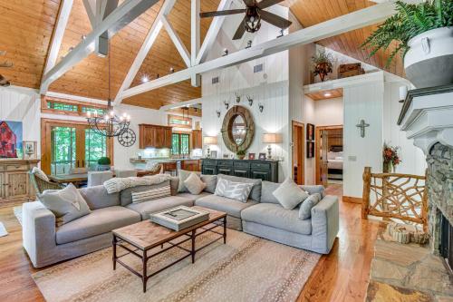 a living room with a couch and a table at Luxe Trillium Home with Fire Pit, 5 Mi to Cashiers in Cullowhee