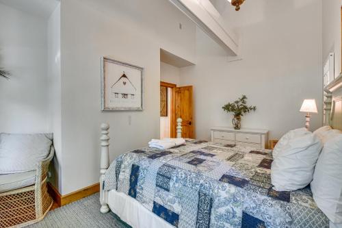 a bedroom with a bed and a chair at Luxe Trillium Home with Fire Pit, 5 Mi to Cashiers in Cullowhee