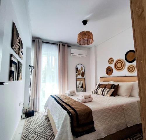 a bedroom with a large bed and a large window at Casa Di Penny 1 in Kyparissia