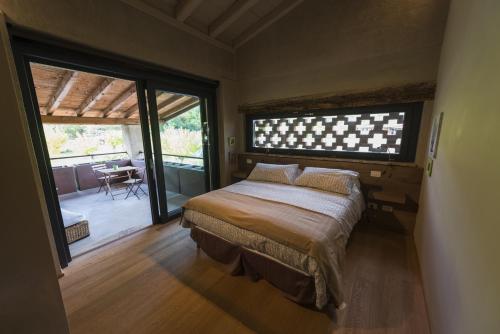 Ένα ή περισσότερα κρεβάτια σε δωμάτιο στο Agriturismo Locanda Del Pesco
