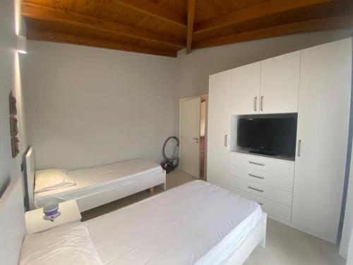 Postel nebo postele na pokoji v ubytování Casa di vacanze