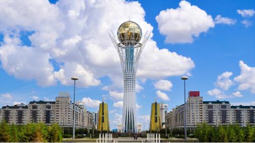 a view of a tower in a city with buildings at Holiday Inn Express - Astana - Turan by IHG in Astana