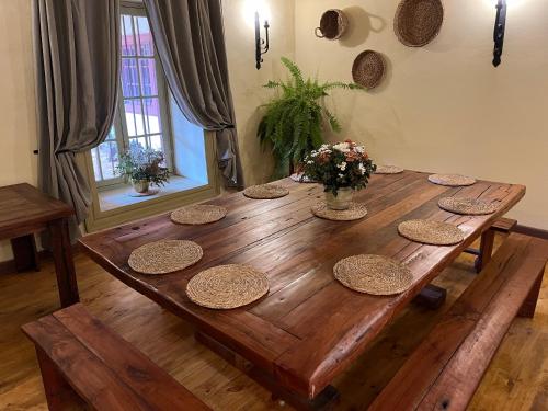 a wooden table with baskets on top of it at CASONA SAN PEDRO Hotel Boutique in San Javier