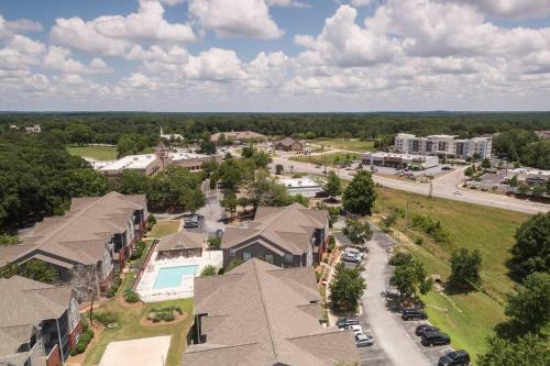 an aerial view of a residential neighborhood with houses at Vibrant Living Near Auburn University l 4BR 4BA in Auburn