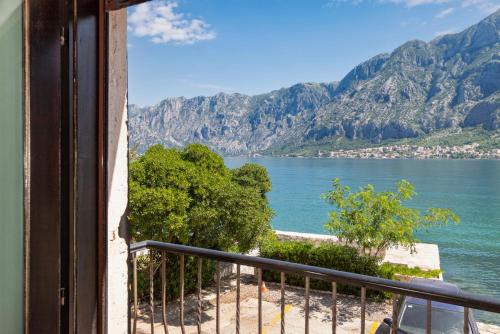 a view of a body of water from a balcony at Apartments Saxo in Kotor