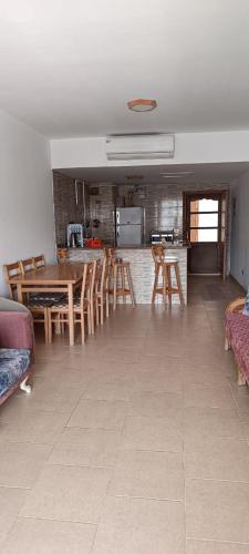 a kitchen and dining room with a table and chairs at شالية بقرية بالميرا in Ain Sokhna