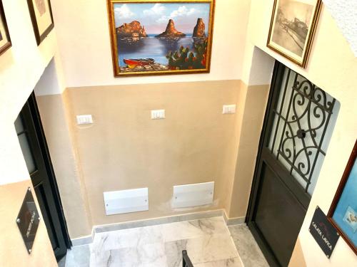 a hallway with a painting on the wall at Eruption1669 in Catania