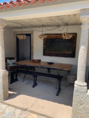 a room with a wooden table in a room at Villa Elia in Seixas