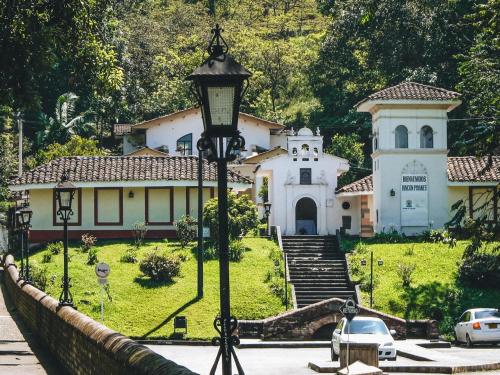 a house with a street light in front of it at Hotel La Herreria Colonial in Popayan