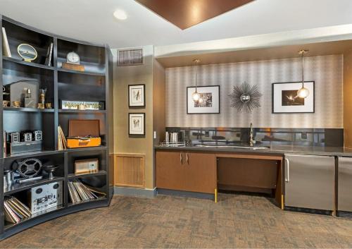 a large kitchen with a counter and a sink at Stylish 1 Bedroom Apartment in LA with Free Parking - 10 Minutes away from Ceders Sinai in Los Angeles