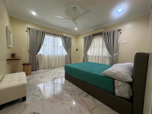 Ένα ή περισσότερα κρεβάτια σε δωμάτιο στο UncleLiew Cozy Home 老刘民宿