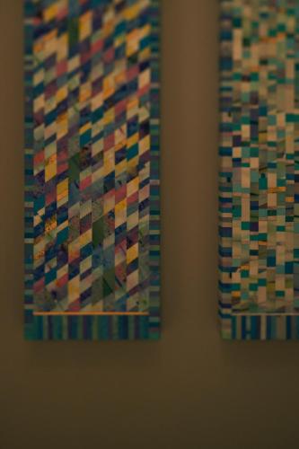 a close up of two paintings on a wall at ESPACIO The Hakone Geihinkan Rin-Poh-Ki-Ryu in Hakone