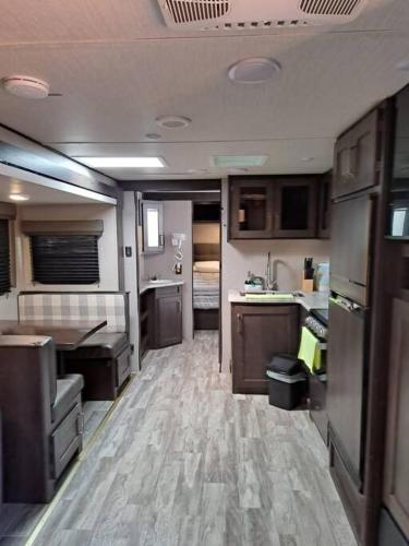 a room with a kitchen and a dining room at Sunset Trailer Park RV # 4 in El Suazal
