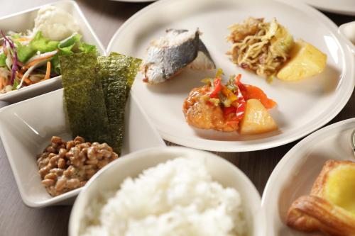 a group of plates of food on a table at Super Hotel Sano Fujioka in Sano