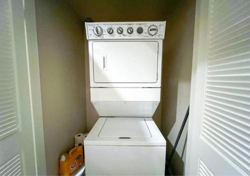 a white stove top oven in a small kitchen at Cozy Home in LA - Free Parking 10 Min to Cedars in Los Angeles