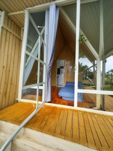 an inside view of a house with a large window at Tuyết Hoa Hòn Bồ Homestay in Da Lat