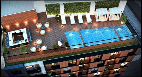 Una vista aérea de un edificio con piscina. en Minidepartamento de estreno, en Lima