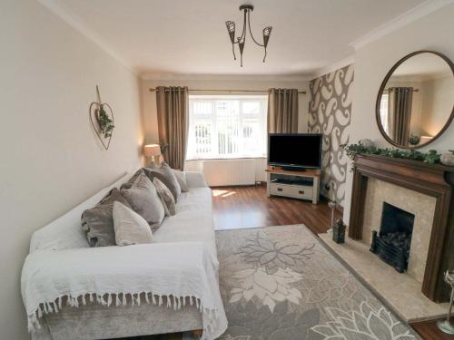 Postel nebo postele na pokoji v ubytování Lilly May Cottage