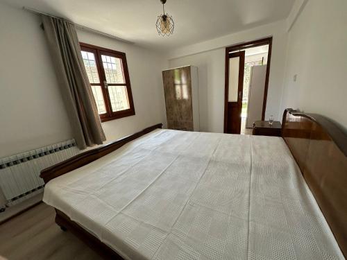 Ένα ή περισσότερα κρεβάτια σε δωμάτιο στο Soprana’s Home