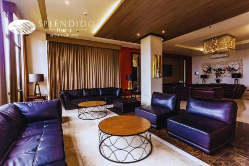 a lobby with couches and tables in a hotel at Splendido Tagaytay Hotel and Country Club in Tagaytay