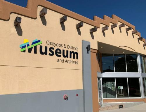 a building with the entrance to a museum and archives at Holiday Inn Hotel & Suites Osoyoos by IHG in Osoyoos