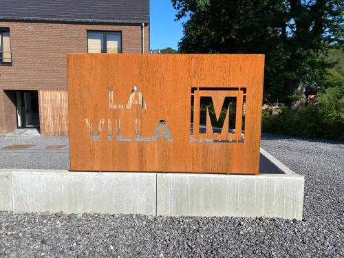 a sign with the word willemia written on it at La villa M in Sart-lez-Spa