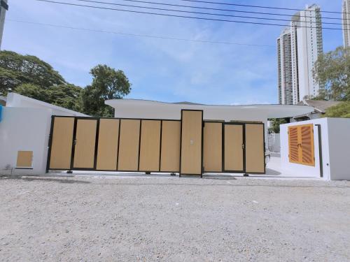 a set of doors in front of a building at PNT LUXURY JOMTIEn in Jomtien Beach
