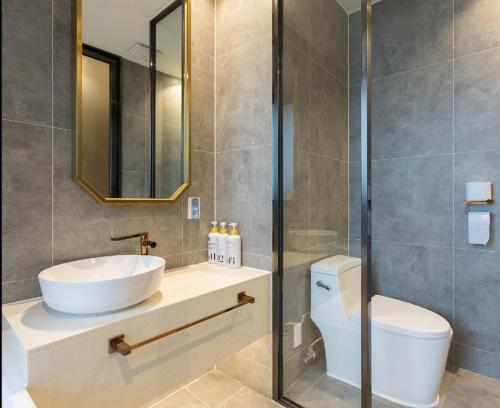 a bathroom with a sink and a toilet at Desarts Hotel in Seoul