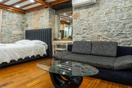 a living room with a couch and a table at Villa Domina in Split