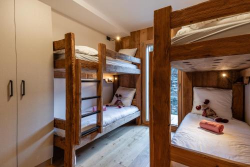 Postel nebo postele na pokoji v ubytování Chalet Le Refuge